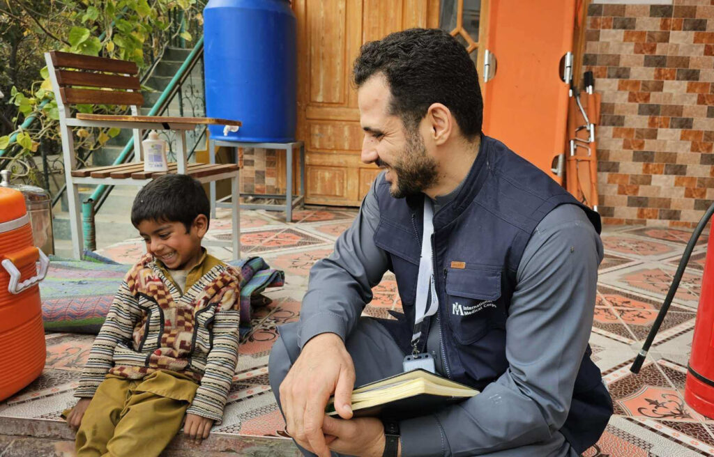 Afghanistan Country Director Ahmed Kassas talk to Majeed, whose sister had come to our health facility in Nangarhar province for care.