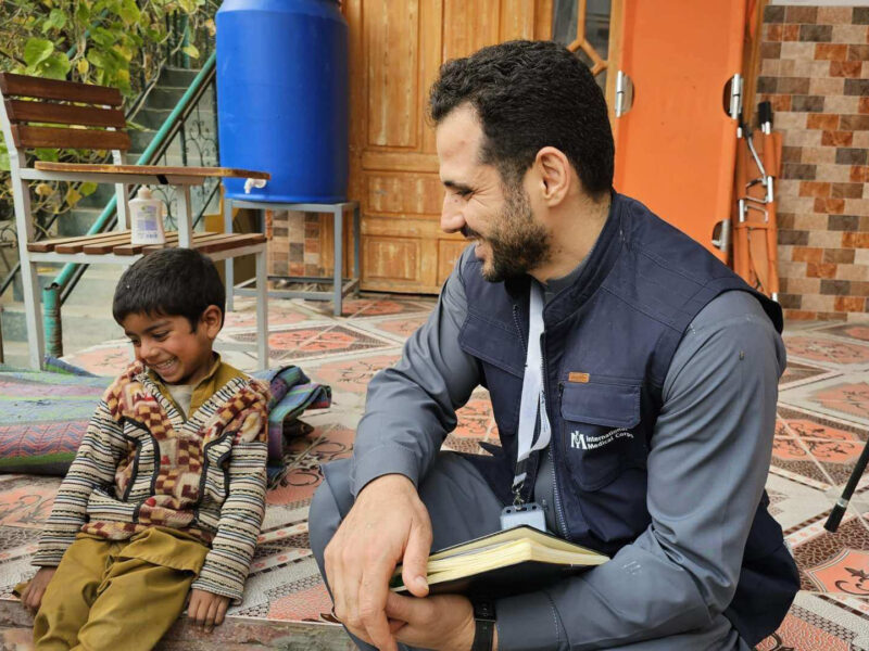 Afghanistan Country Director Ahmed Kassas talk to Majeed, whose sister had come to our health facility in Nangarhar province for care.