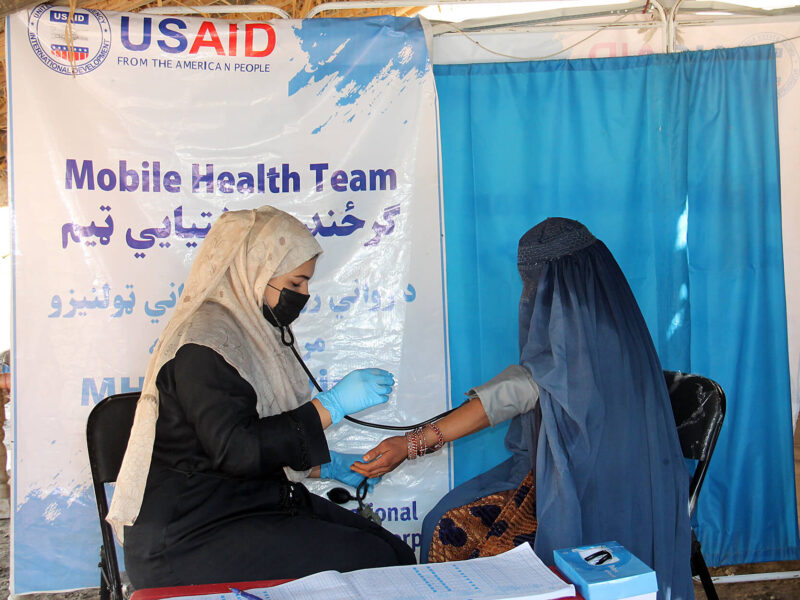 Mursal, a midwife with International Medical Corps’ mobile team in Afghanistan, examines a patient in a remote village.