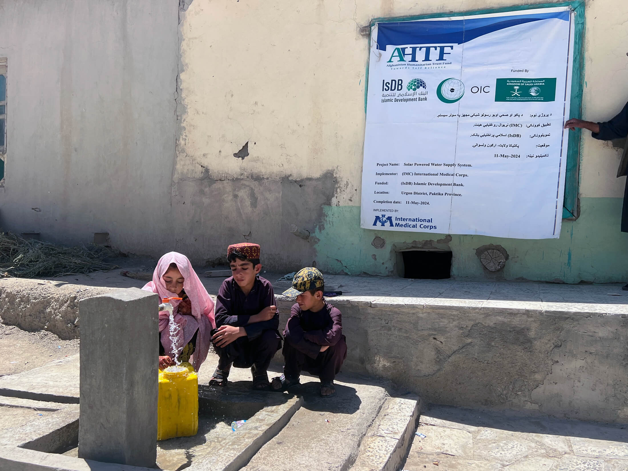 AFGH_Picture---5 Families collect water from a water tab built by our teams.