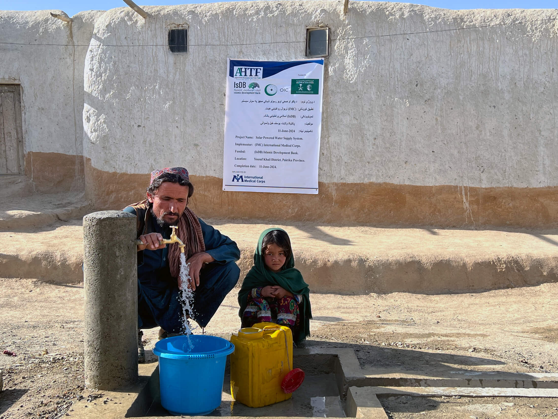 AFGH_Picture---7 Families collect water from a water tab built by our teams.