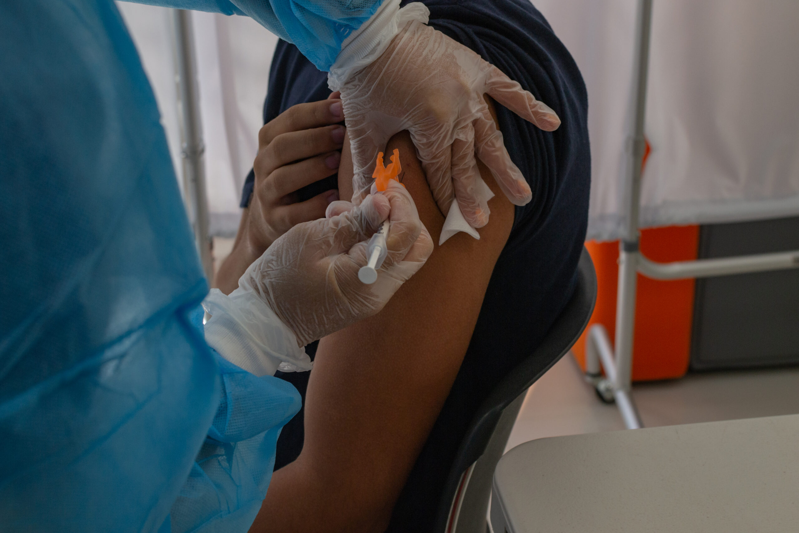 PHSU - Ponce Health Sciennces University Site Visit Kathleen Rodríguez, a nurse at the PHSU, vaccinates a young man against COVID-19 at the PHSU in Ponce, Puerto Rico.