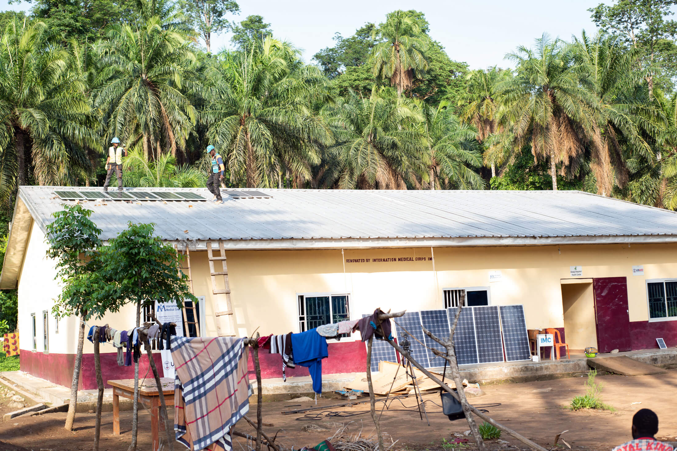 CAM_DSC_2848 Workers install solar panels on the roof of the Akwaja Integrated Health Center.