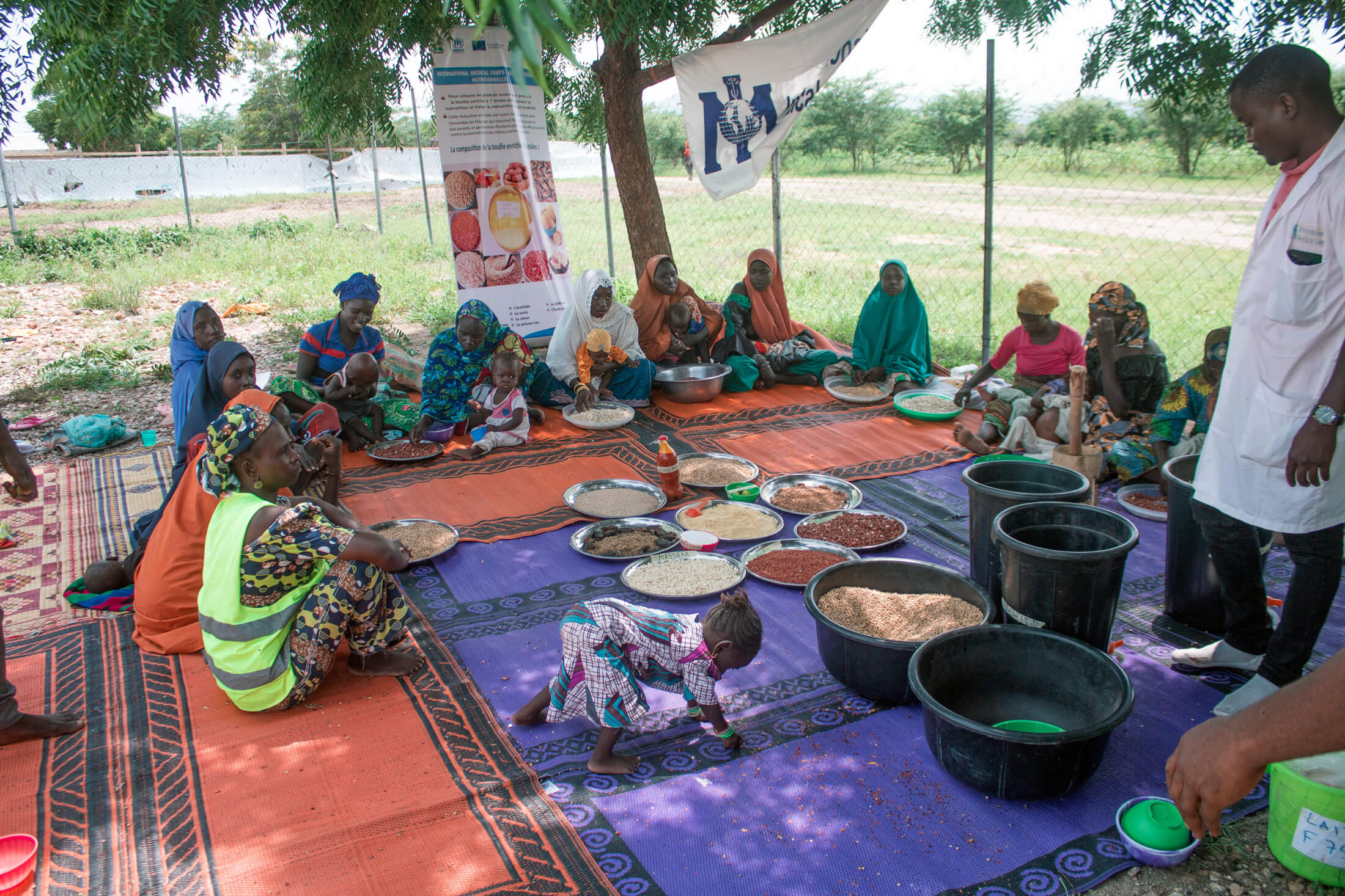 CAM_IMG_7692 Participants learn about enriched porridge at a cooking demonstration at the Minawao Refugee Camp.