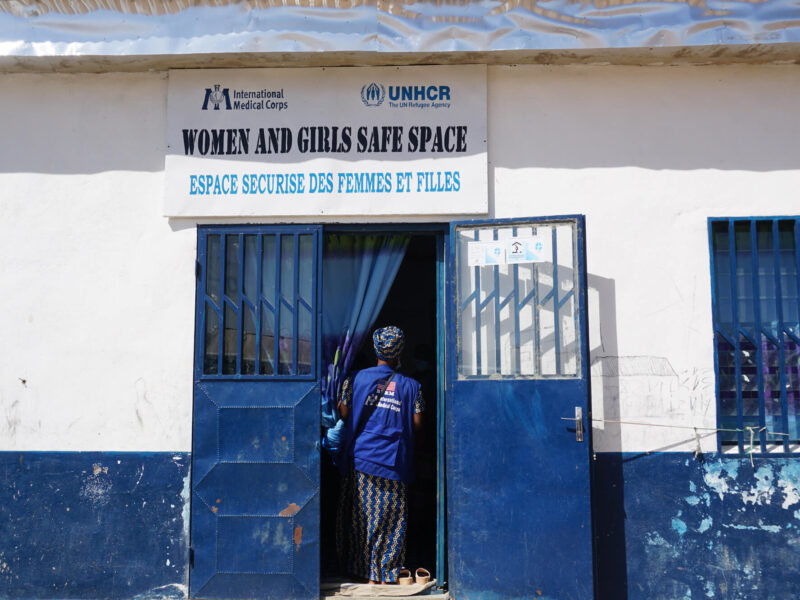 A woman enters a WGSS in Cameroon, similar to the one attended by Jeanne and Marie in Central African Republic.