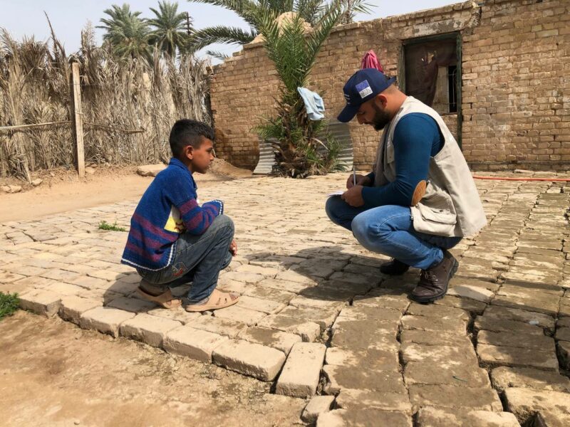 Ahmed and an International Medical Corps CHW inside the camp.