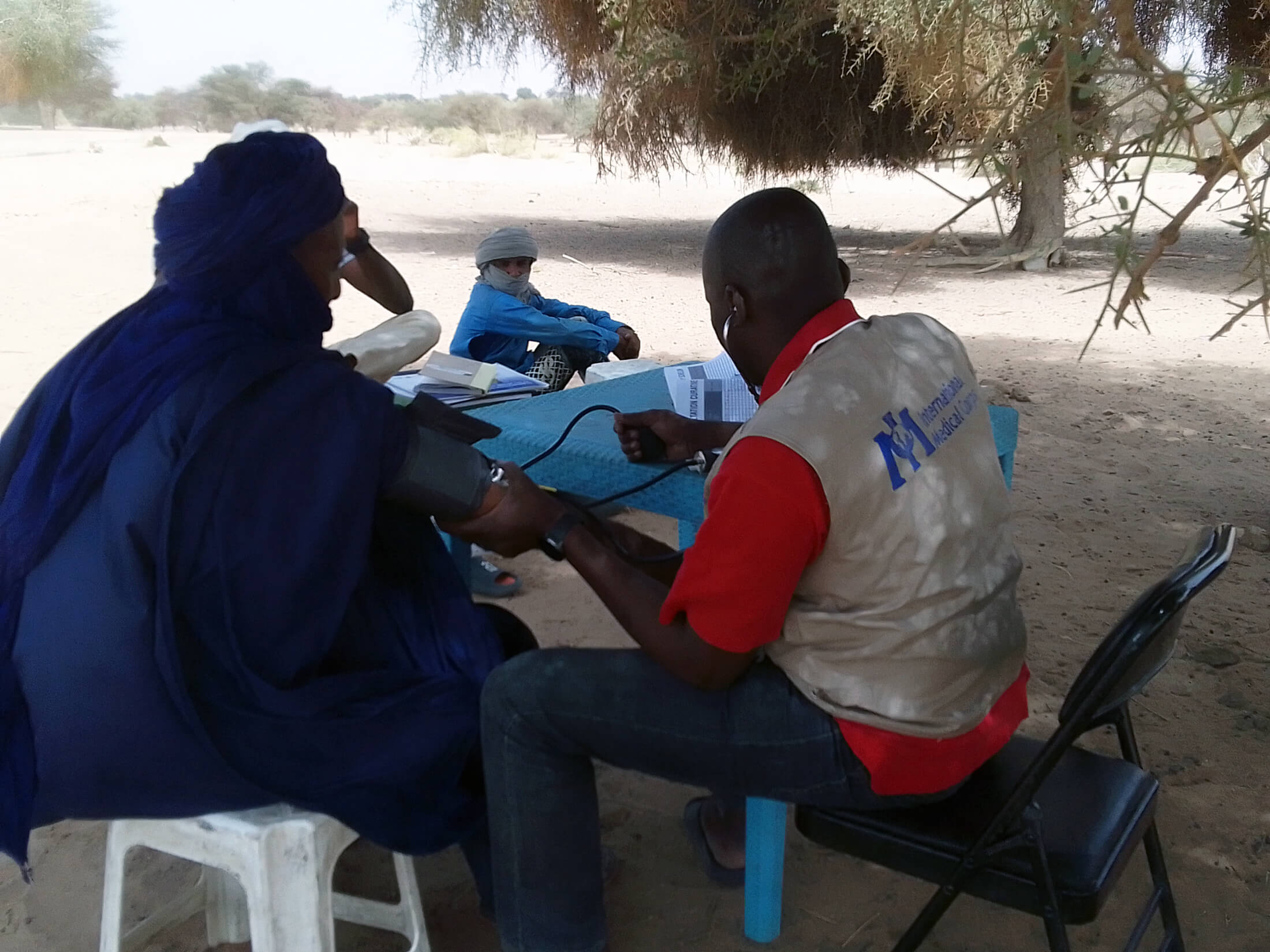 Curative-Consultation_Dr-Landoure-Ibrahima,-Timbuktu-MMU-Medical-Doctor-2 Dr. Landoure Ibrahima, working with the Timbuktu MMU, gives a patient a curative consultation.