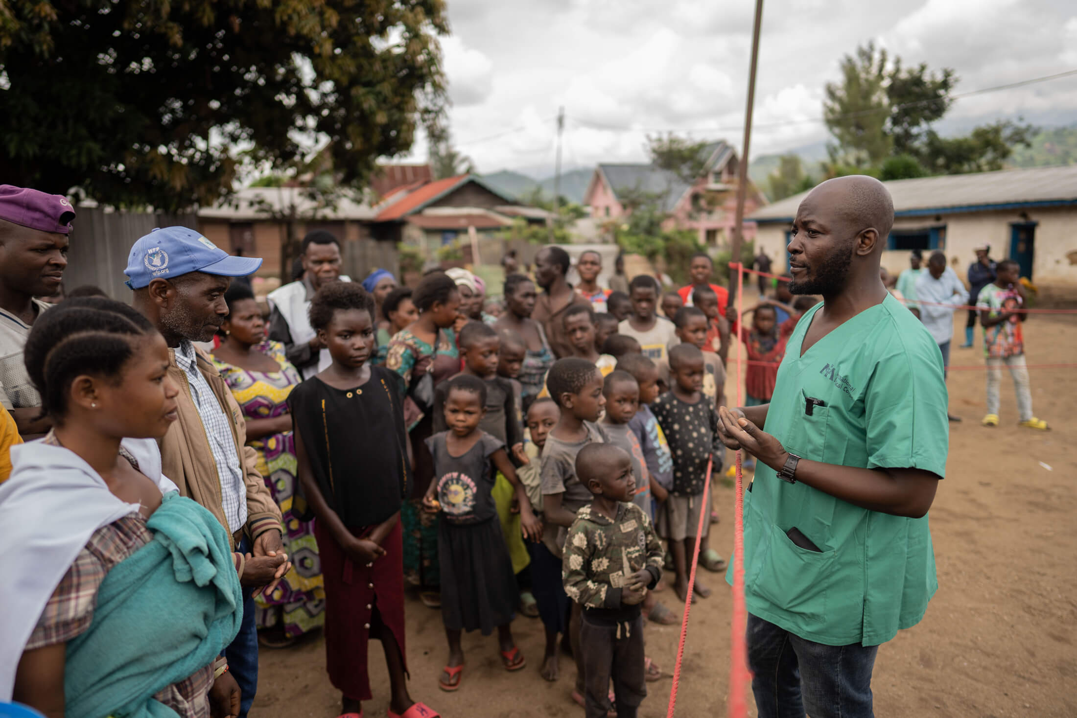 DRC_Moses_IMC_sawasawa_0045 Program Manager Bienvenu speaks with local community members about International Medical Corps, our mission and the services our MMU team is providing.