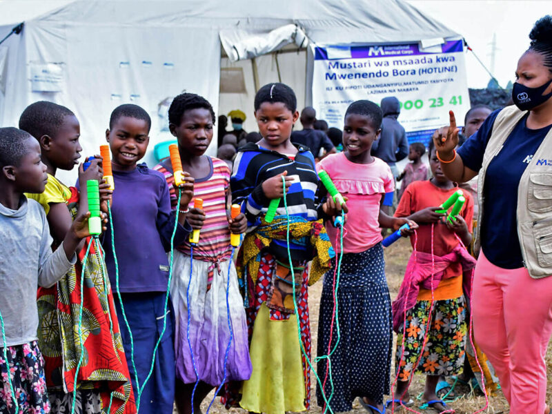 Nelly Ngongo teaches children how to jump rope.