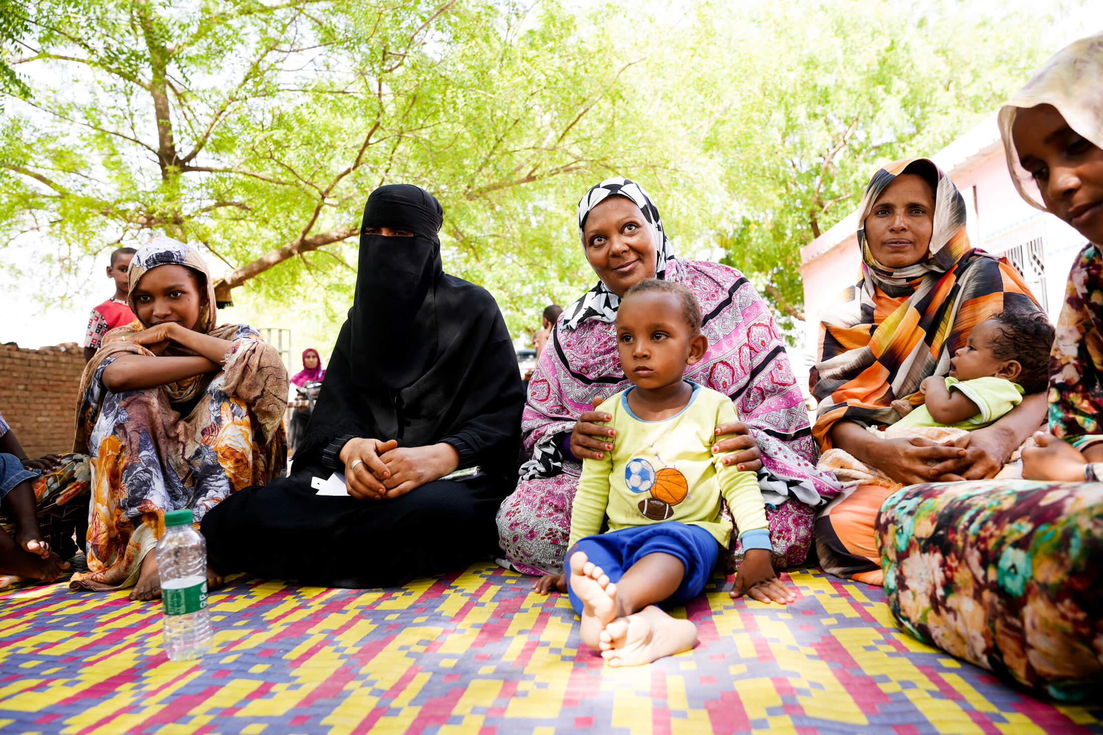 DSC05212 Three-year-old Abdallah sits in front of his mother, Mushriga Alzain (center), during the group meeting.