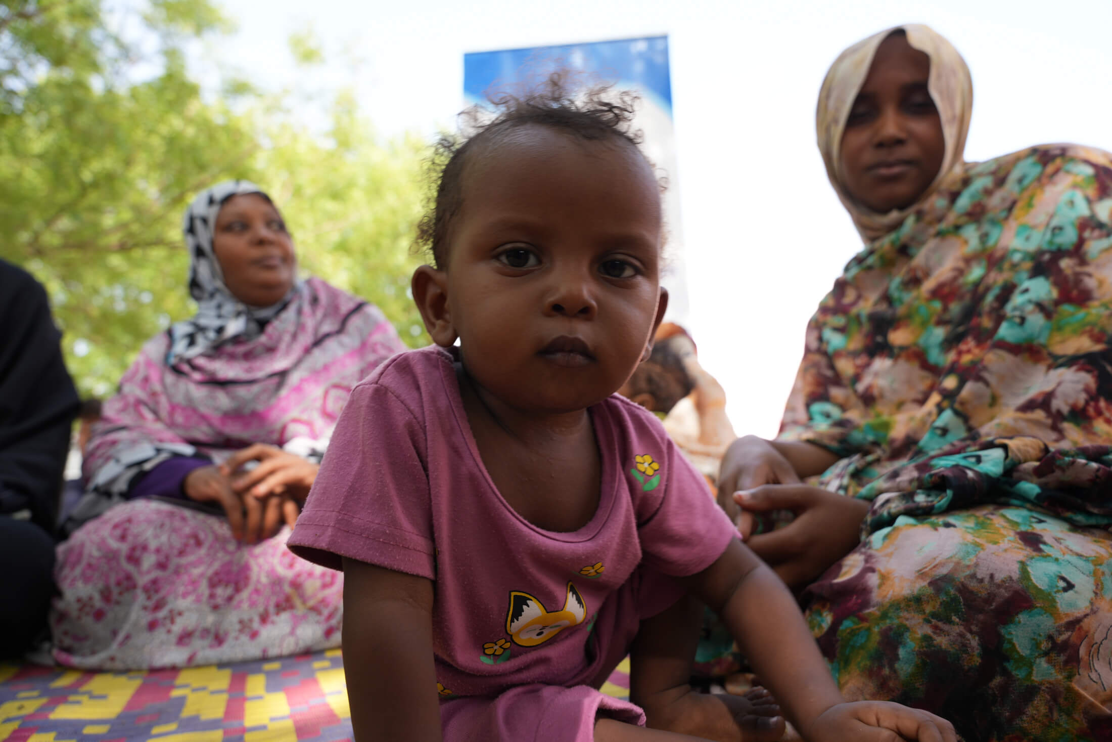 DSC05275 One-year-old Ashgan lives with her mother, Muna (right), father and several siblings.