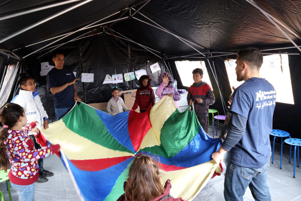 Child Protection specialists lead a play session at our field hospital.
