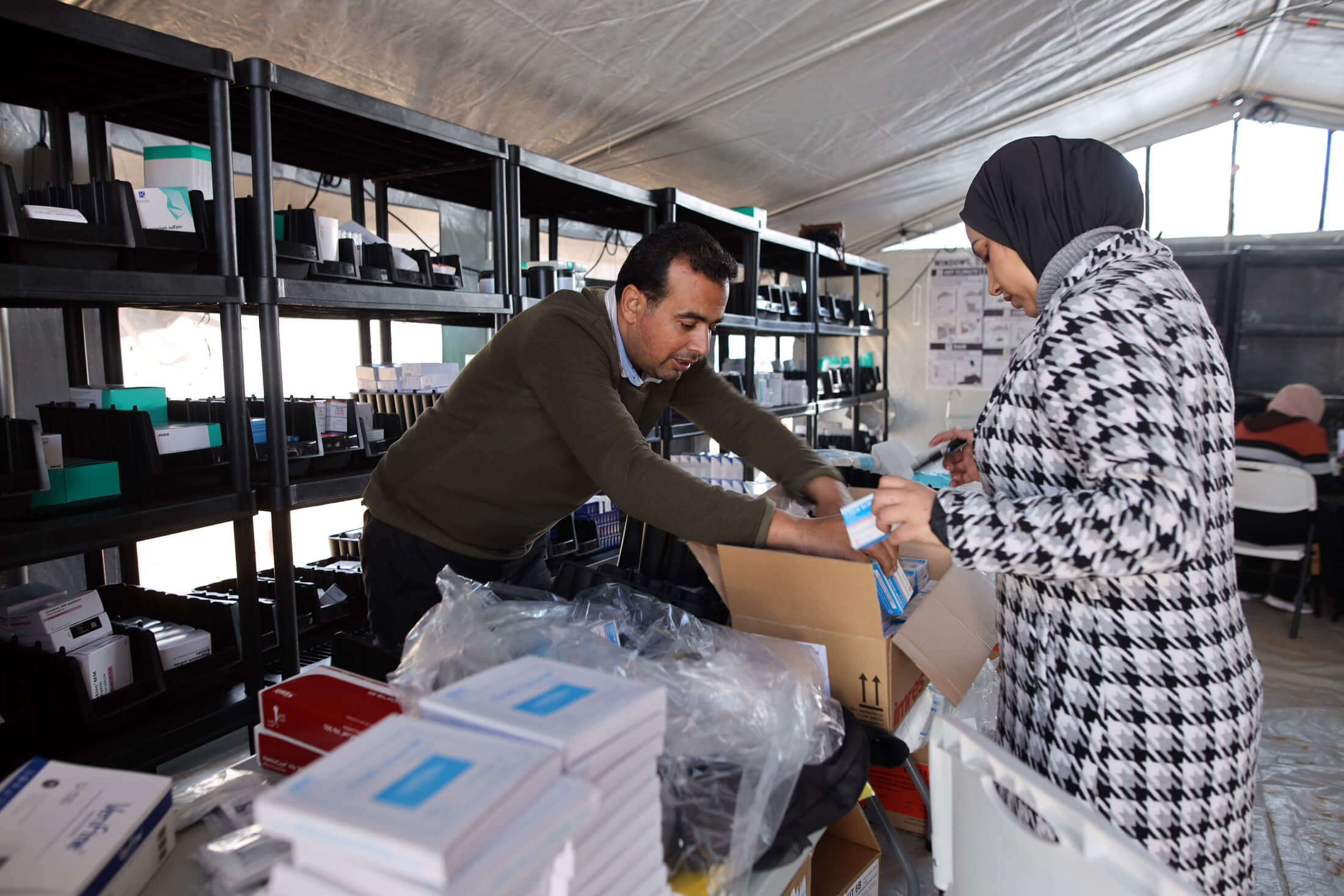 GAZA_8U0A0123 Our staff stock the field hospital with medicine and other essential supplies.