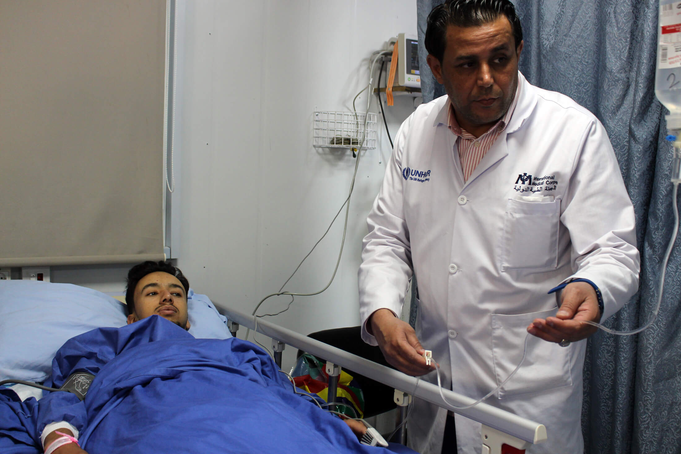 JORD_B_IMG_0155 Charge nurse Mohammed Ismali cares for a patient in the hospital's emergency room.