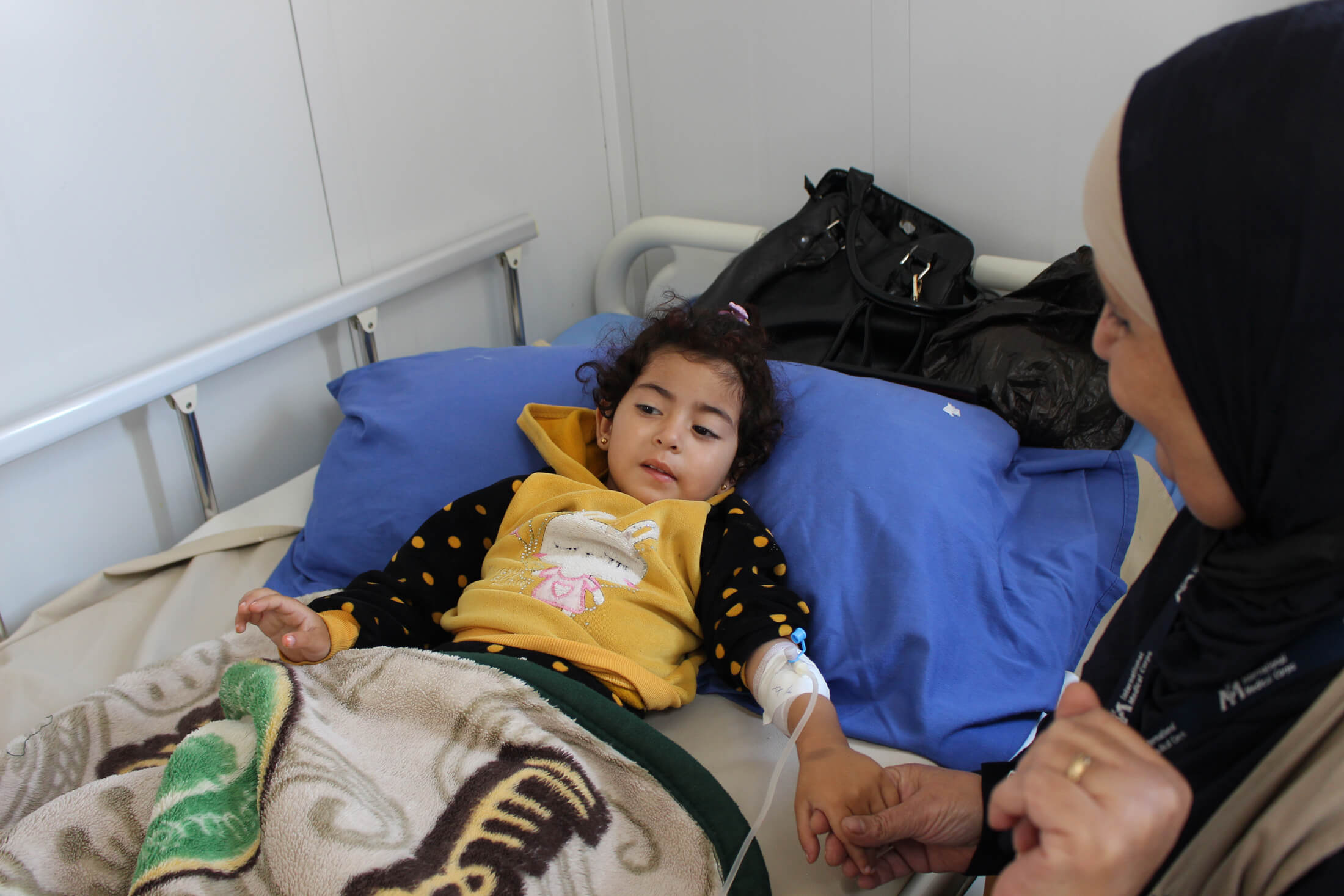 JORD_B_IMG_0264 Pediatric charge nurse Reem al Majali visits a young girl in the hospital’s pediatric department.