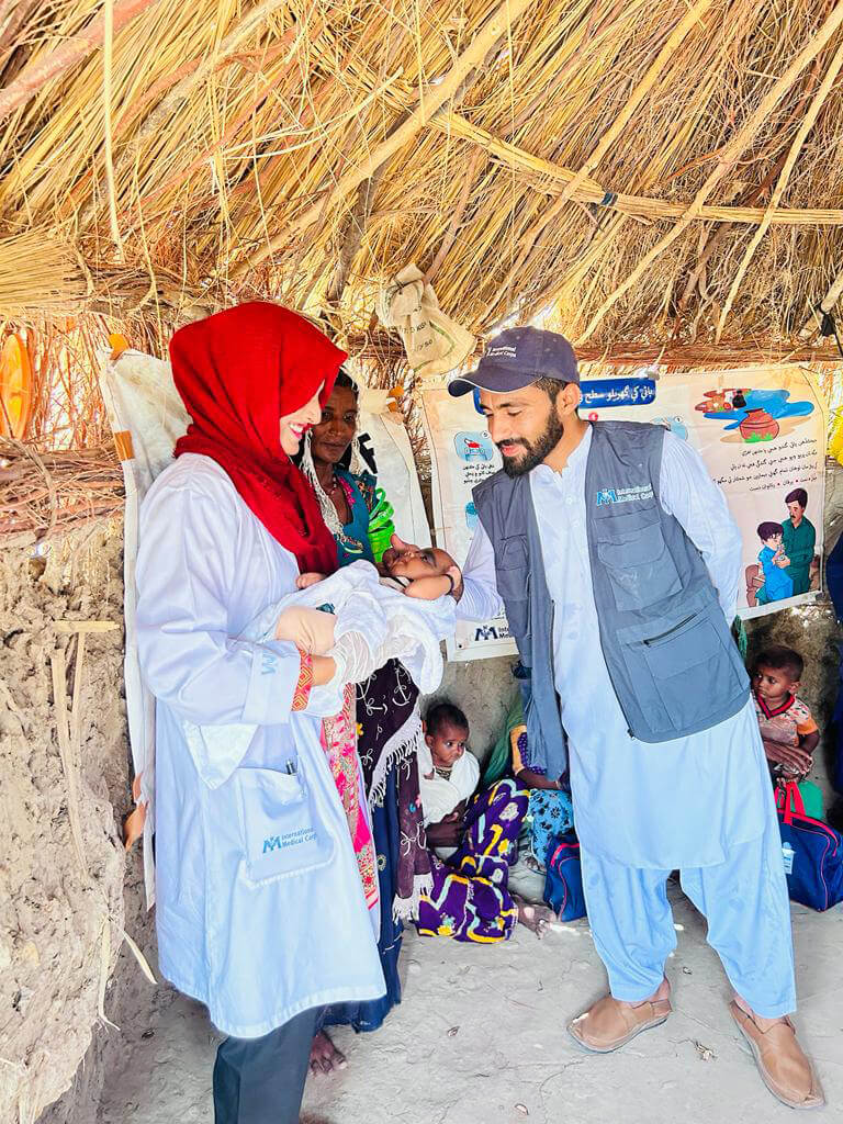 PAK_WhatsApp-Image-2023-06-04-at-00.21.56sd Dr. Nimra Sheikh smiles at Sapa’s baby.