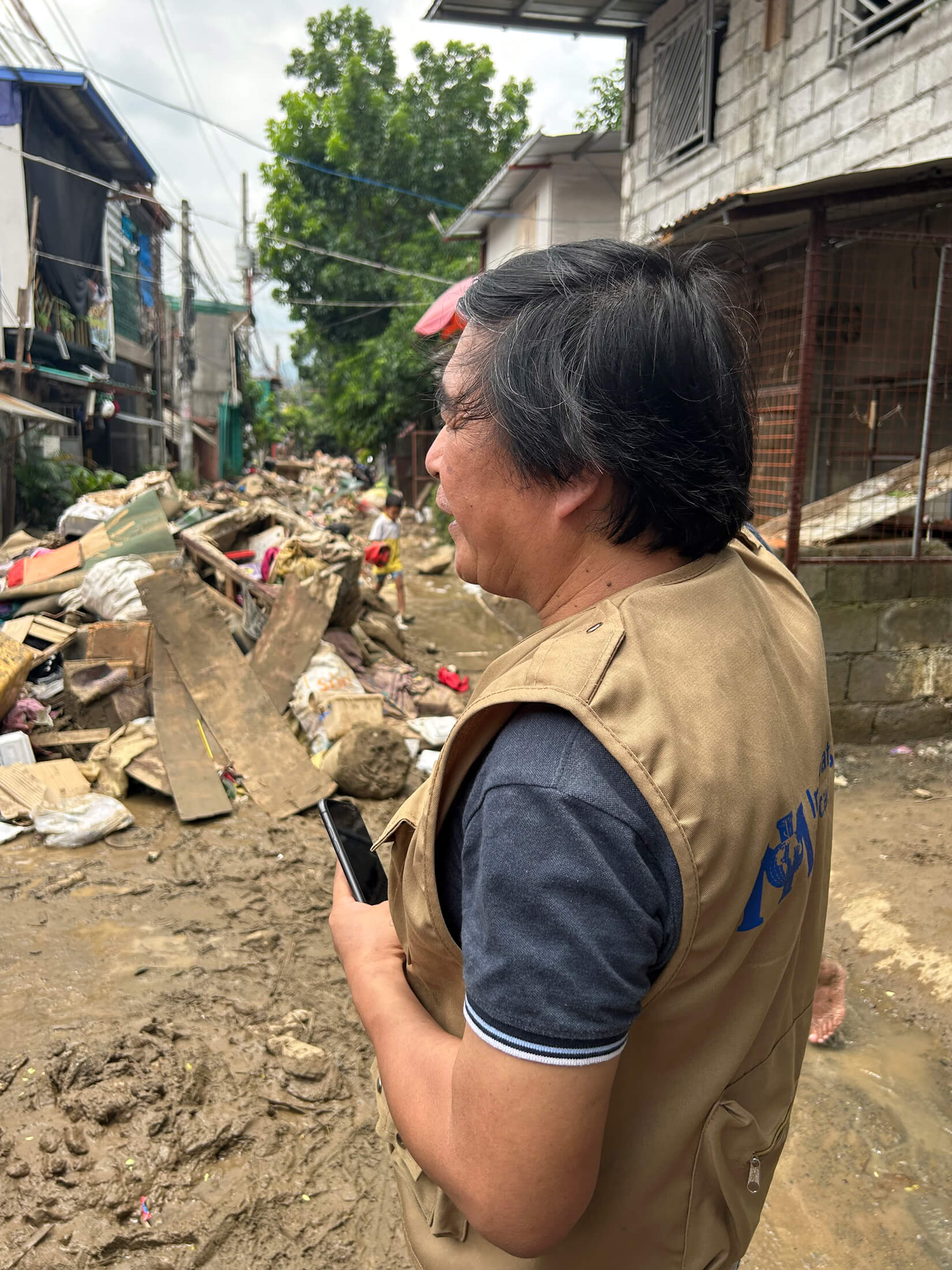 PHIL_IMG_4836 Dr. Jojo Cangao, Medical Director with International Medical Corps, surveys the damage from Typhoon Gaemi while conducting a needs assessment.