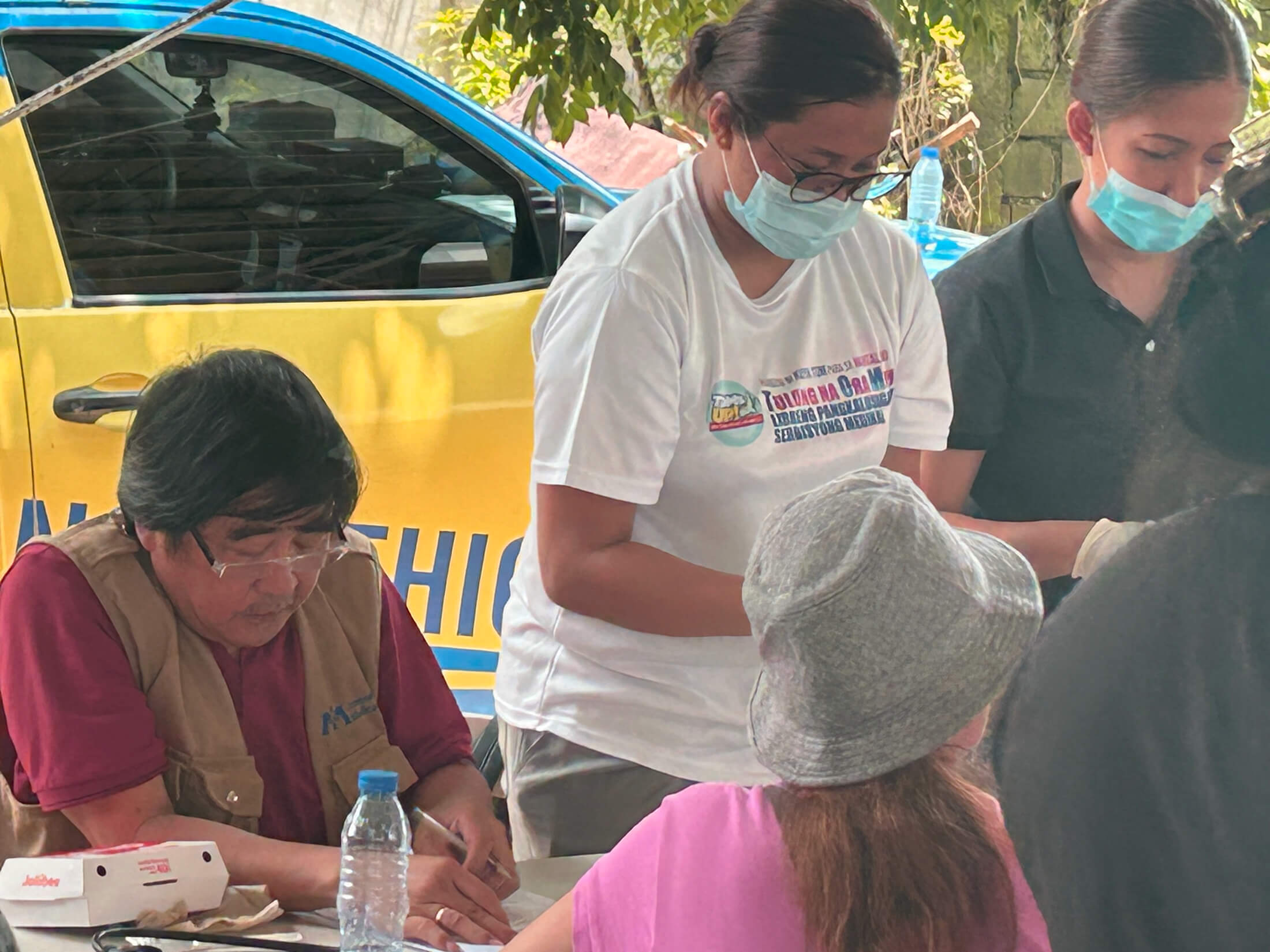 PHIL_IMG_5105 Dr. Jojo Cangao meets with a patient during the mobile medical mission in Barangay San Isidro.