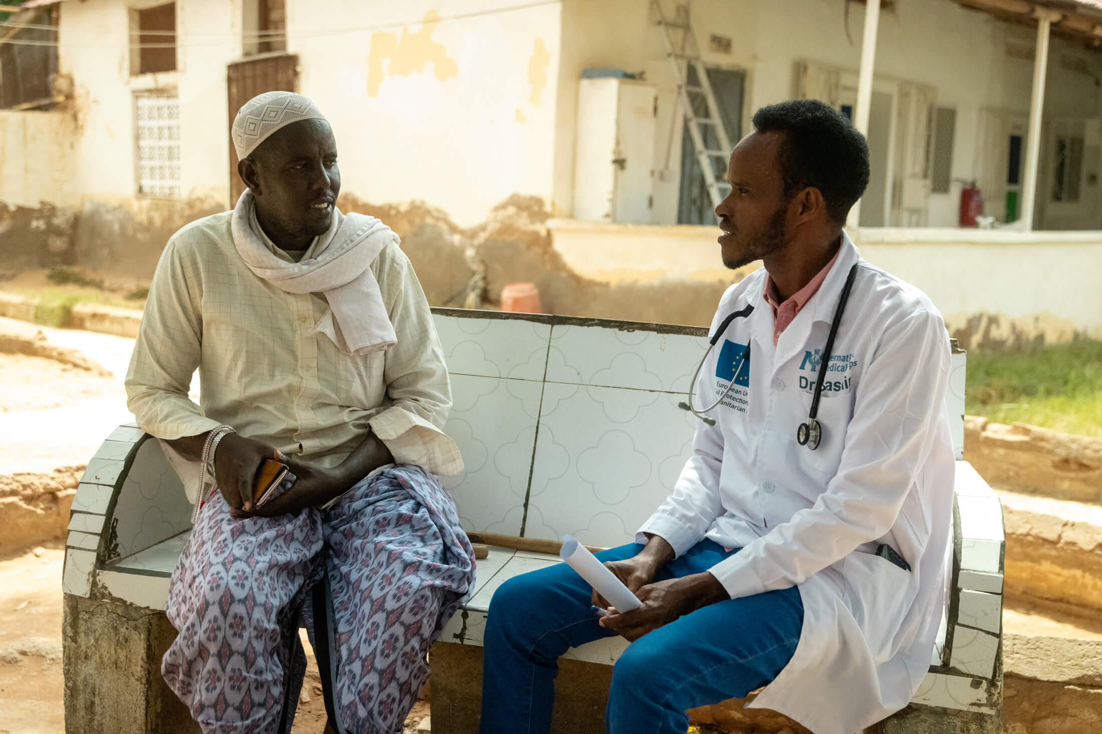 SOM_A-doctor-speaking-to-a-patient-at-the-yard-in-GAS-hospital.-Photo-IMCElphas-Ngugi International Medical Corps doctors and nurses attend to patients at GAS Hospital in Galkayo, Somalia.
