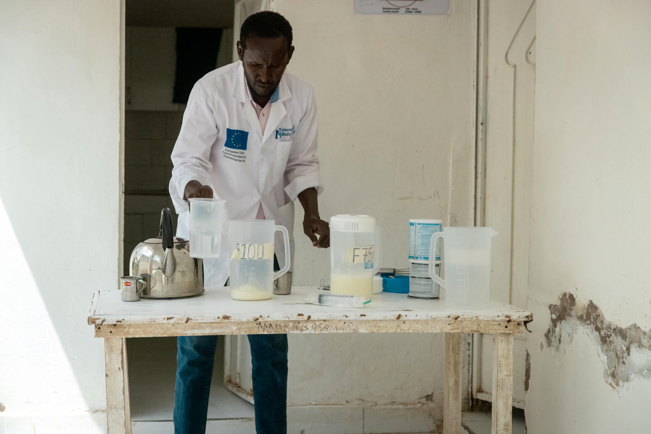 SOM_A-nurse-preparing-milk-at-the-stabilization-center-in-GAS-hospital2.-Photo-IMCElphas-Ngugi One of our nurses prepares milk for infants at the stabilization center.