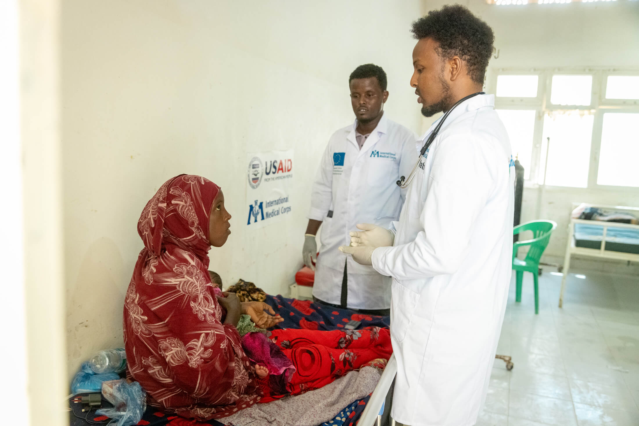 SOM_Dr.-Mahayadin-Matan-attending-to-a-mother-and-her-newborn-in-at-GAS-hospital-in-Somalia---Photo-IMCElphas-Ngugi International Medical Corps doctors and nurses attend to patients at GAS Hospital in Galkayo, Somalia.
