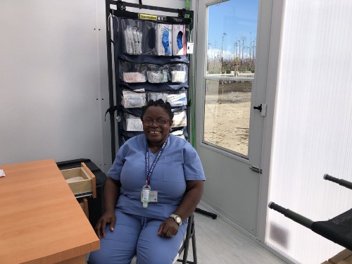 SSYIR2020_Bahamas 4 A nurse prepares to see patients inside the hospitainer.