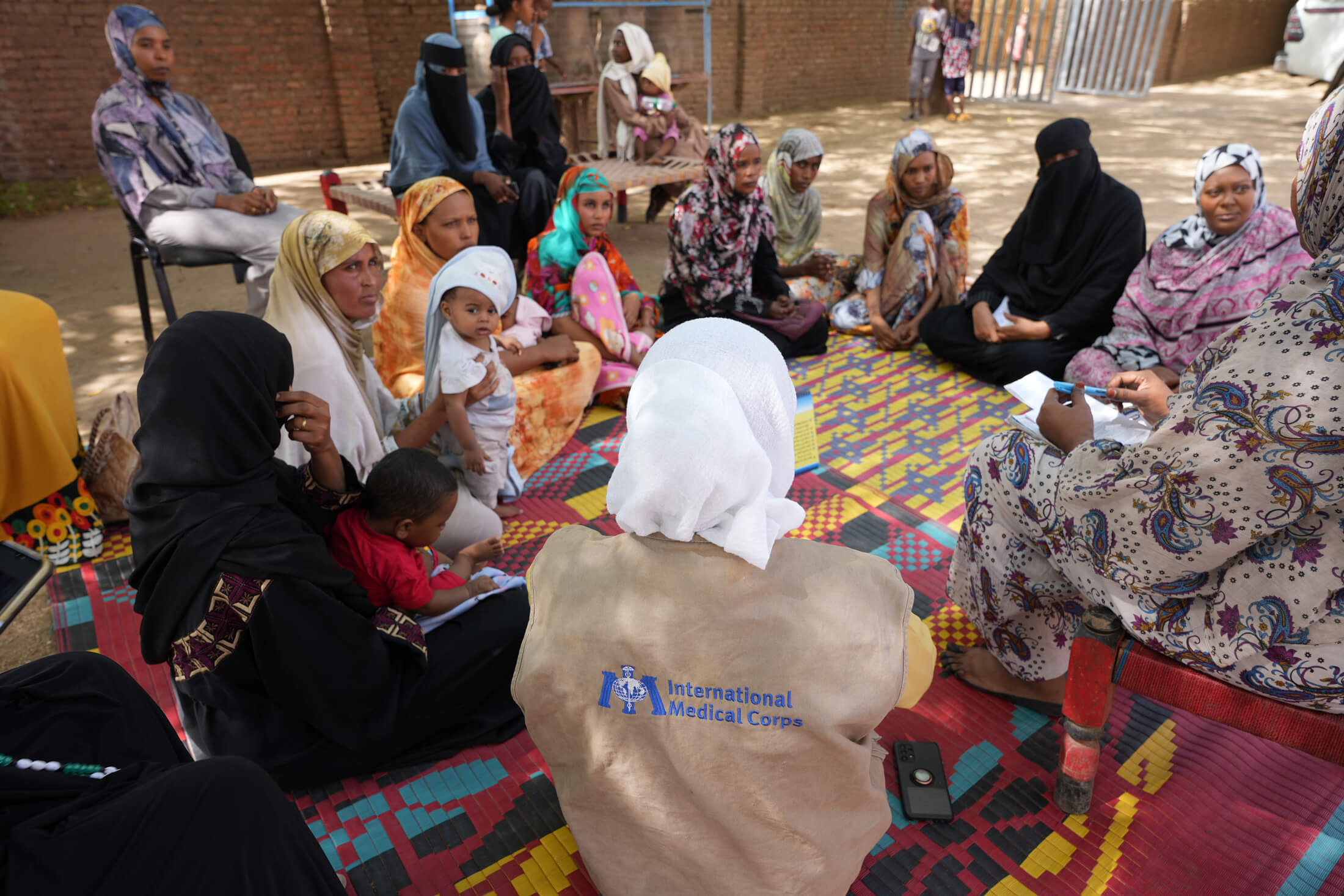 SUD_DSC05128 An International Medical Corps staff member leads a mother-to-mother support group, where our nutrition team provides breastfeeding training sessions to pregnant and lactating mothers.