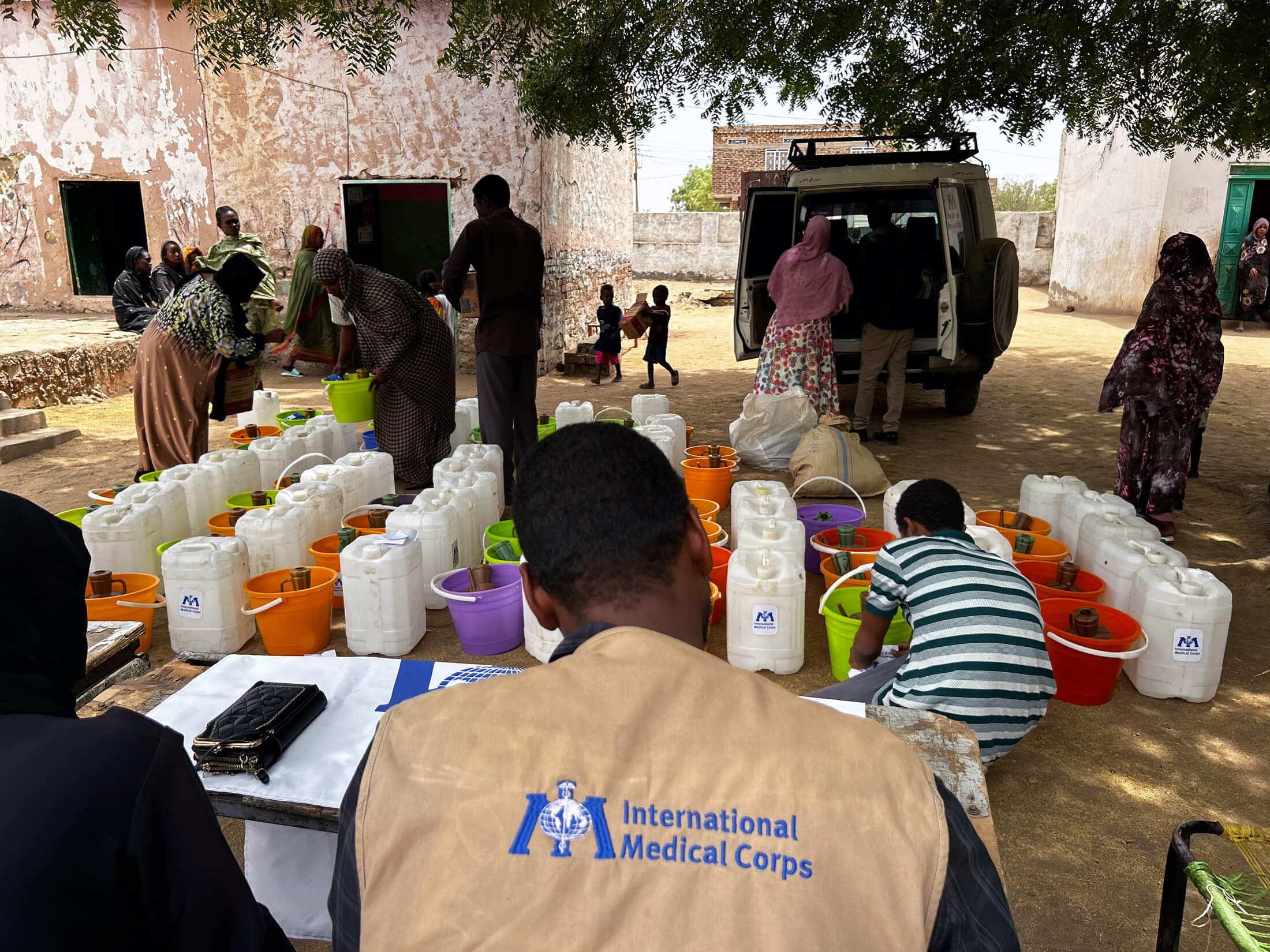 SUD_IMG_6346 Staff members distribute hygiene kits to the community.