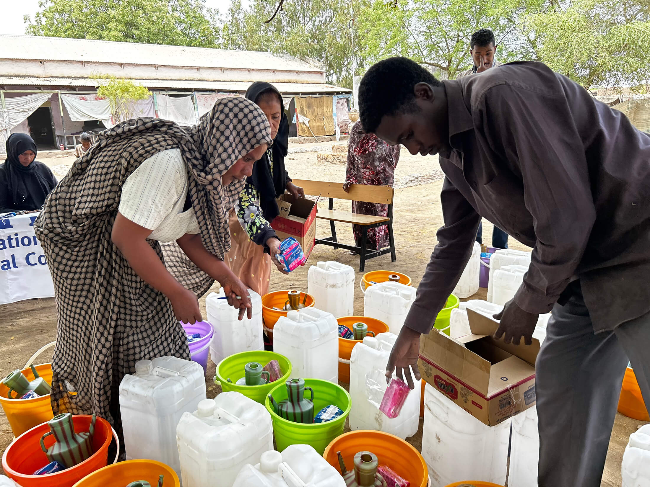 SUD_IMG_6359 Staff members fill the hygiene kits with essential items.