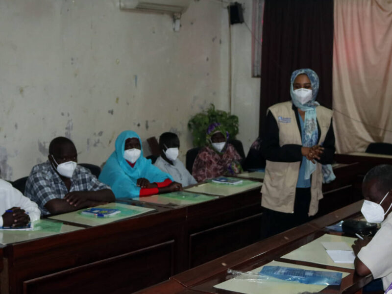 Rania Mohammed Abdalrahman Mohammed leads an infection prevention control training for clinic staff in Ad-Damazin, Sudan.