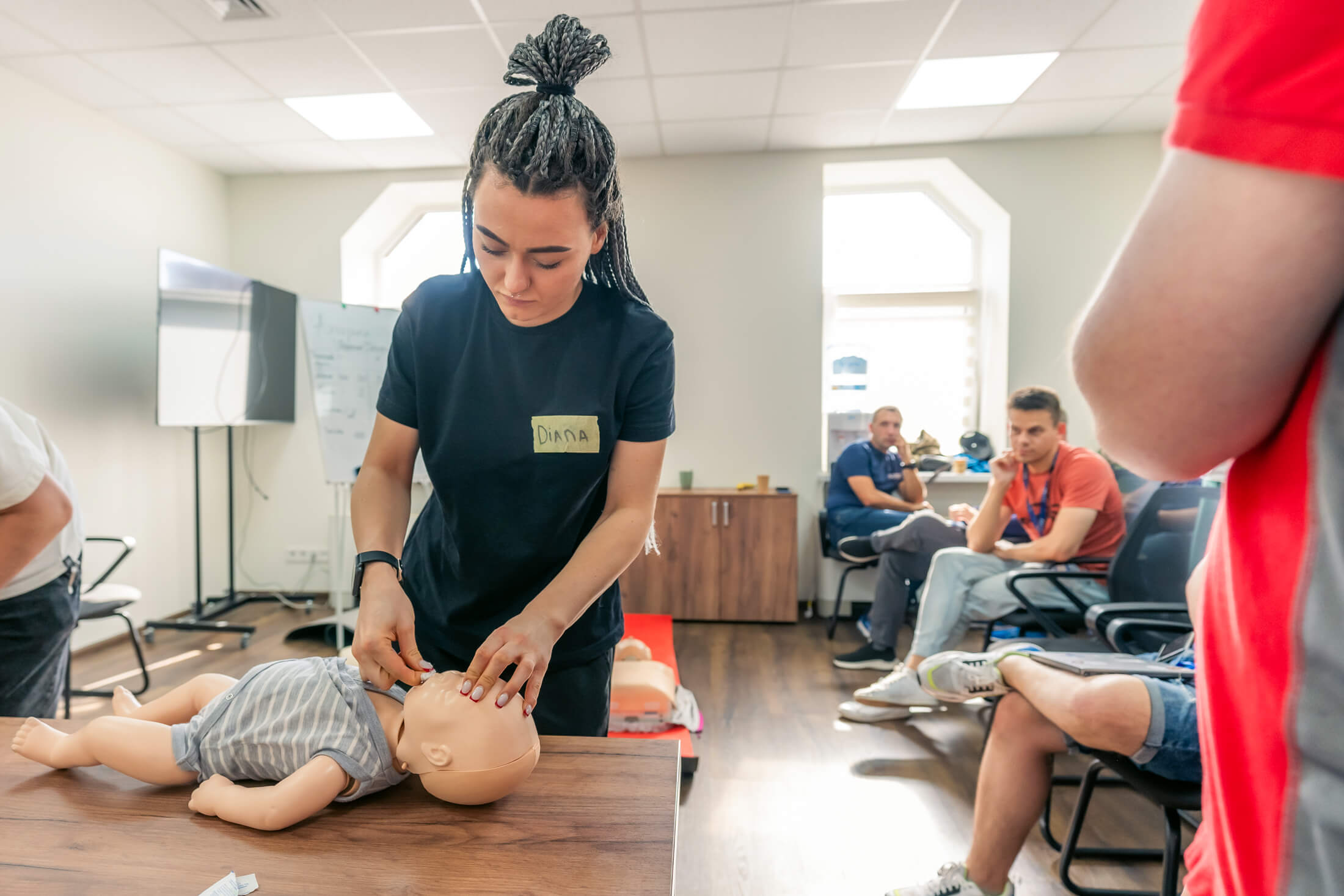 UKR_MIH08855 A participant learns about CPR for children during a first-aid training session in Kyiv.
