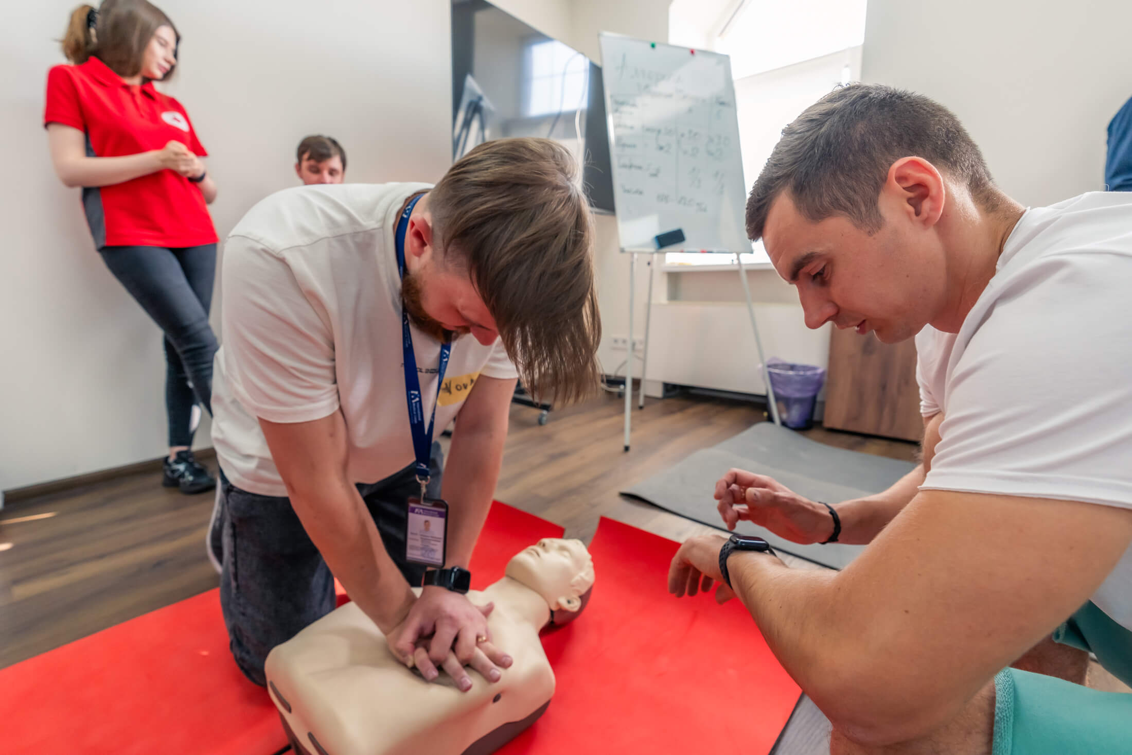UKR_MIH08947 A participant practices chest compressions on a mannequin at a first-aid training session in Kyiv.