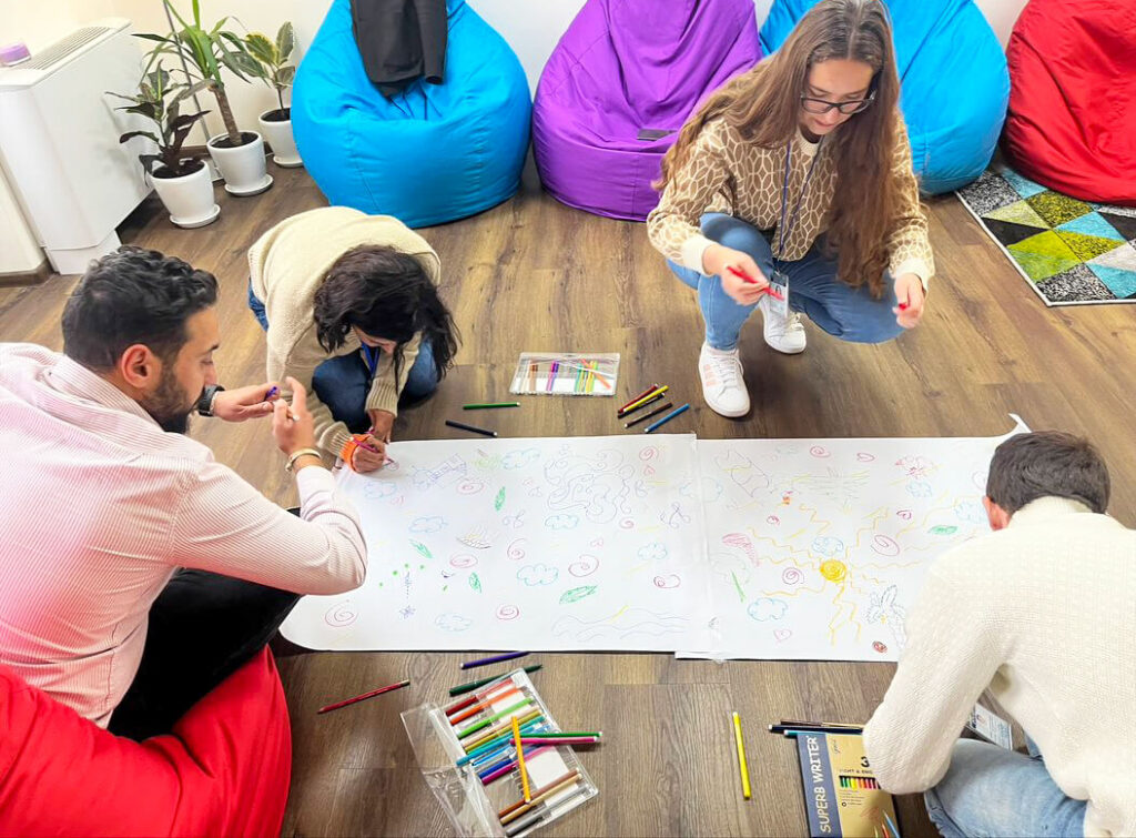 Collaborative painting: a creative activity to let your imagination wander and be fully in the moment.