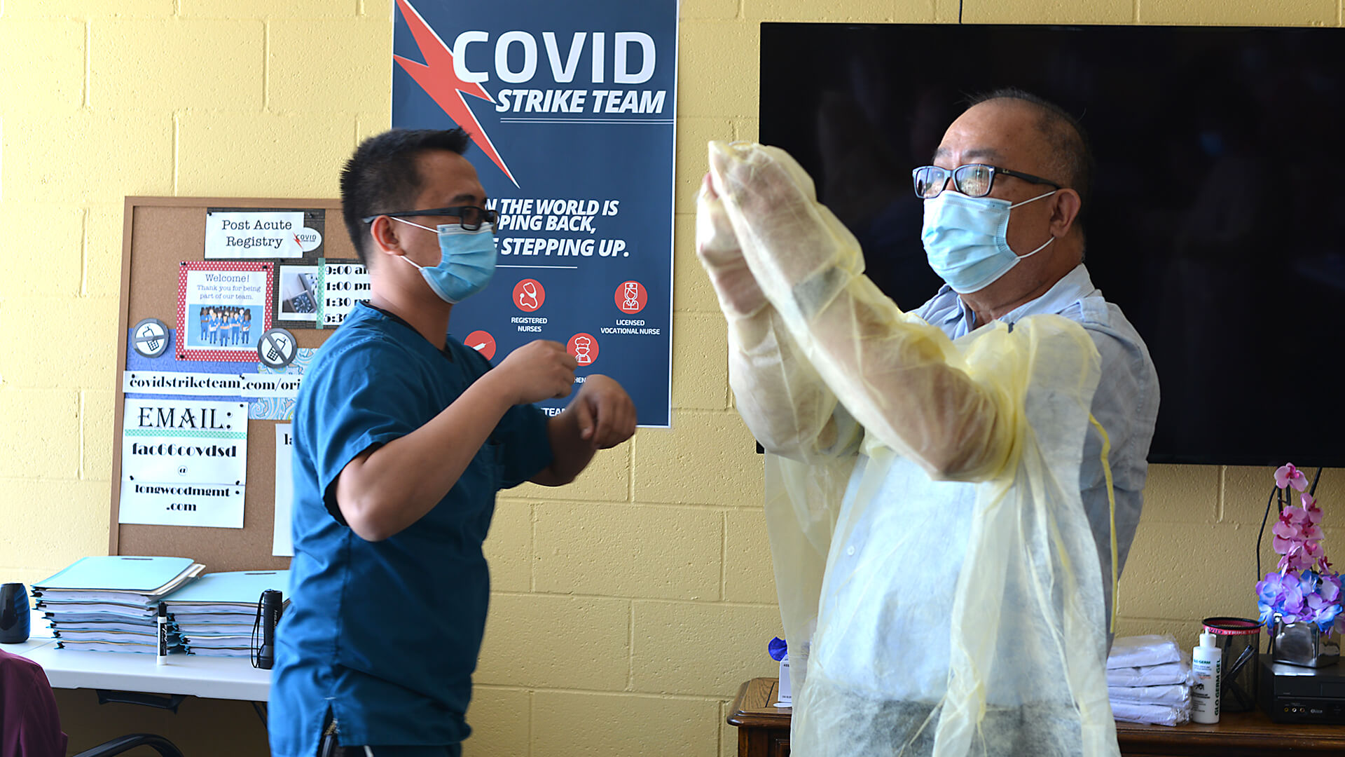 US_03_DSC_3343 Volunteers participate in a COVID-19 demonstration at the Eastland Subacute and Rehabilitation Center in El Monte, California.