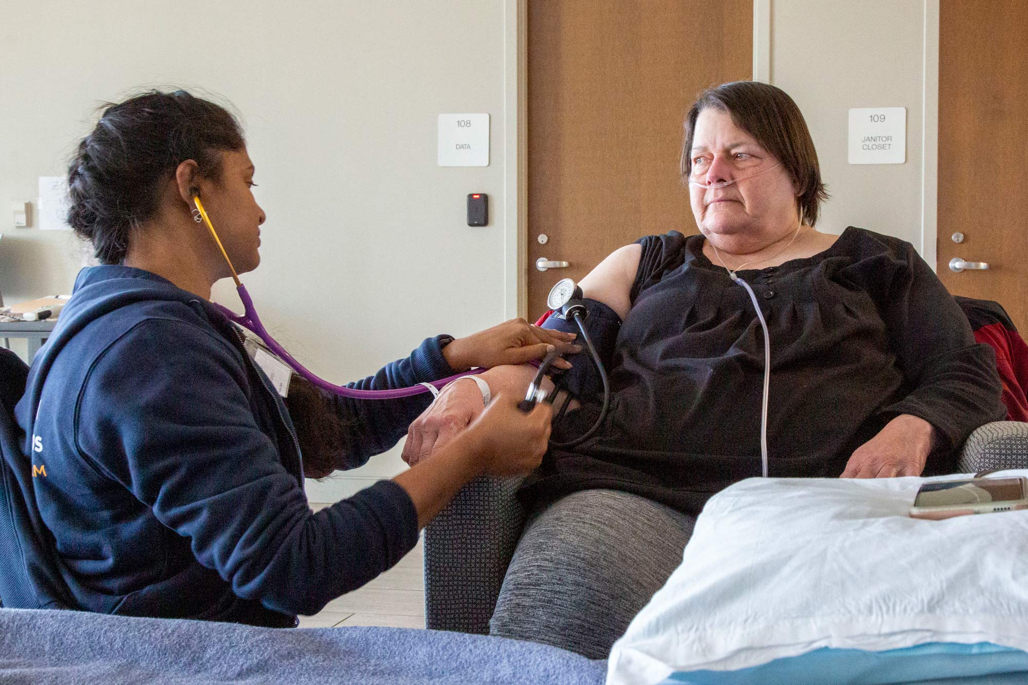Clinical volunteer Shiv Kumarie provides medical care to Katherine, an Asheville resident displaced by Helene. While Katherine was in the shelter at The Ferguson Center for Allied Health & Workforce Development, Shiv helped her manage overwhelming feelings of anxiety and panic. Katherine says, “All of the help that we’ve been getting—everyone pulling together to bring this community back to where it should be—it has been tremendous. Shiv checks on me throughout the day. It makes me feel really cared for.”