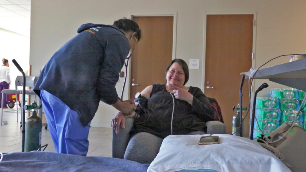 Clinical volunteer Shiv Kumarie takes Katherine Whittaker’s blood pressure at a shelter for residents displaced by Hurricane Helene.