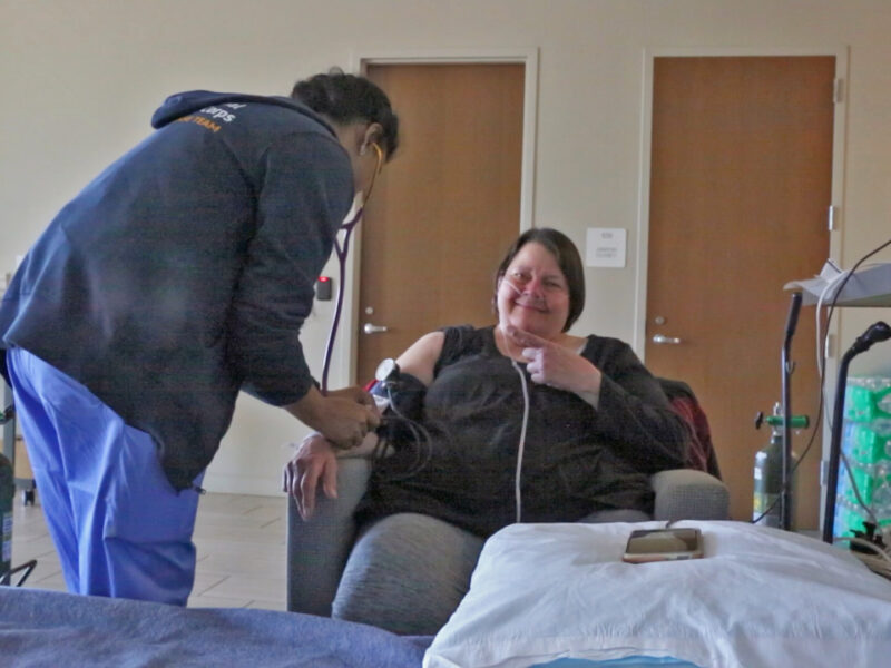 Clinical volunteer Shiv Kumarie takes Katherine Whittaker’s blood pressure at a shelter for residents displaced by Hurricane Helene.