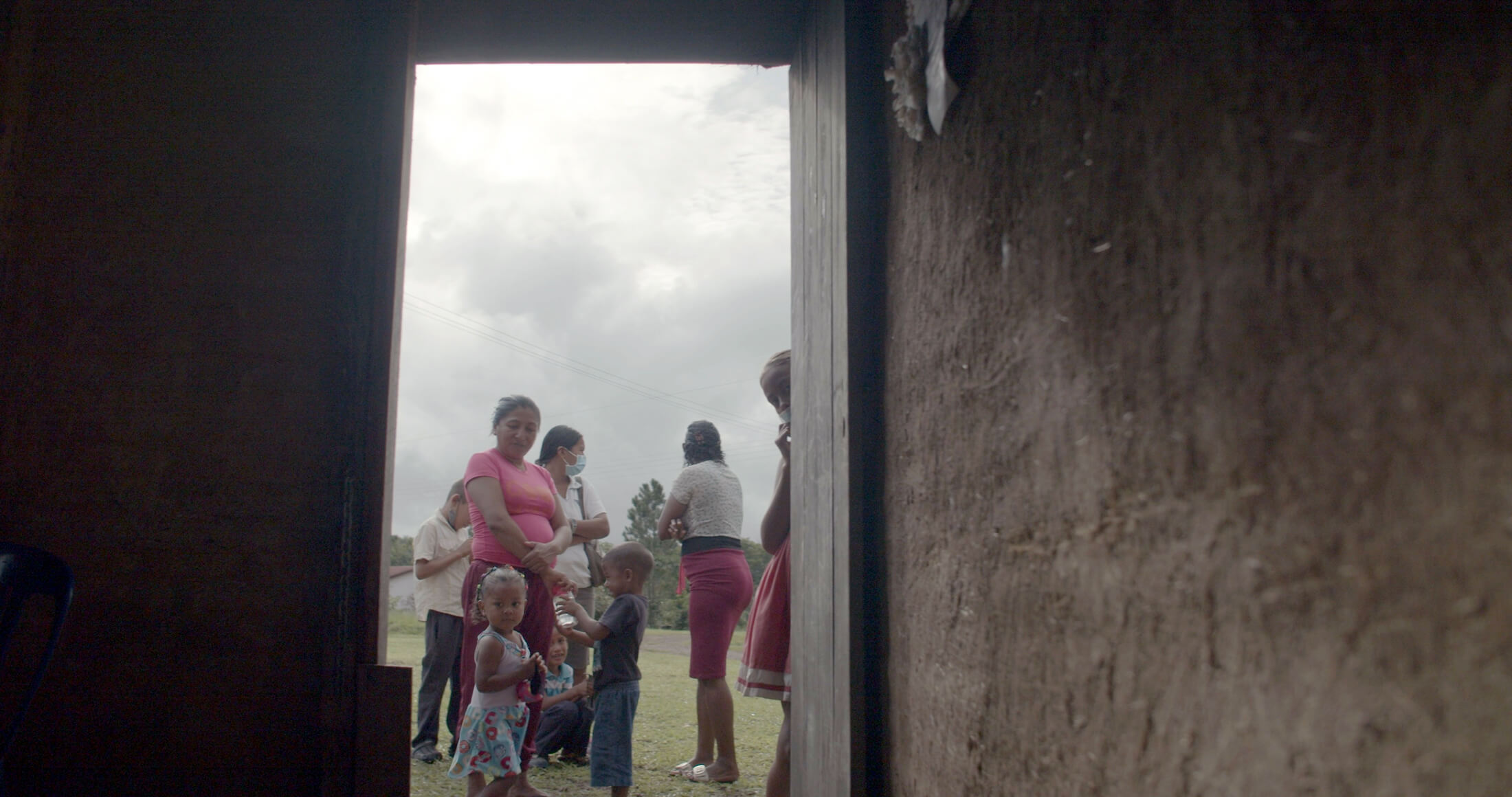 People gather outside the outpatient clinic that village residents constructed using bareque, a traditional building technique of South America’s indigenous people. During deployments, the MMU team also delivers vital supplies for the outpatient center.