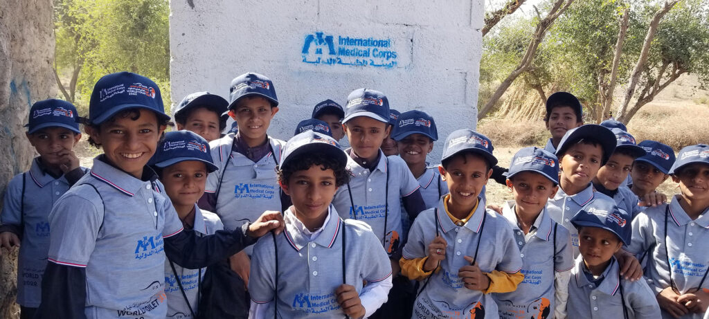 Excited children in Al Ahad village in a rural area of Ibb Governorate pose in front of a recently completed latrine—one of several built in Al Had and the neighboring village of Alkorshoob, communities that only a year ago had none.