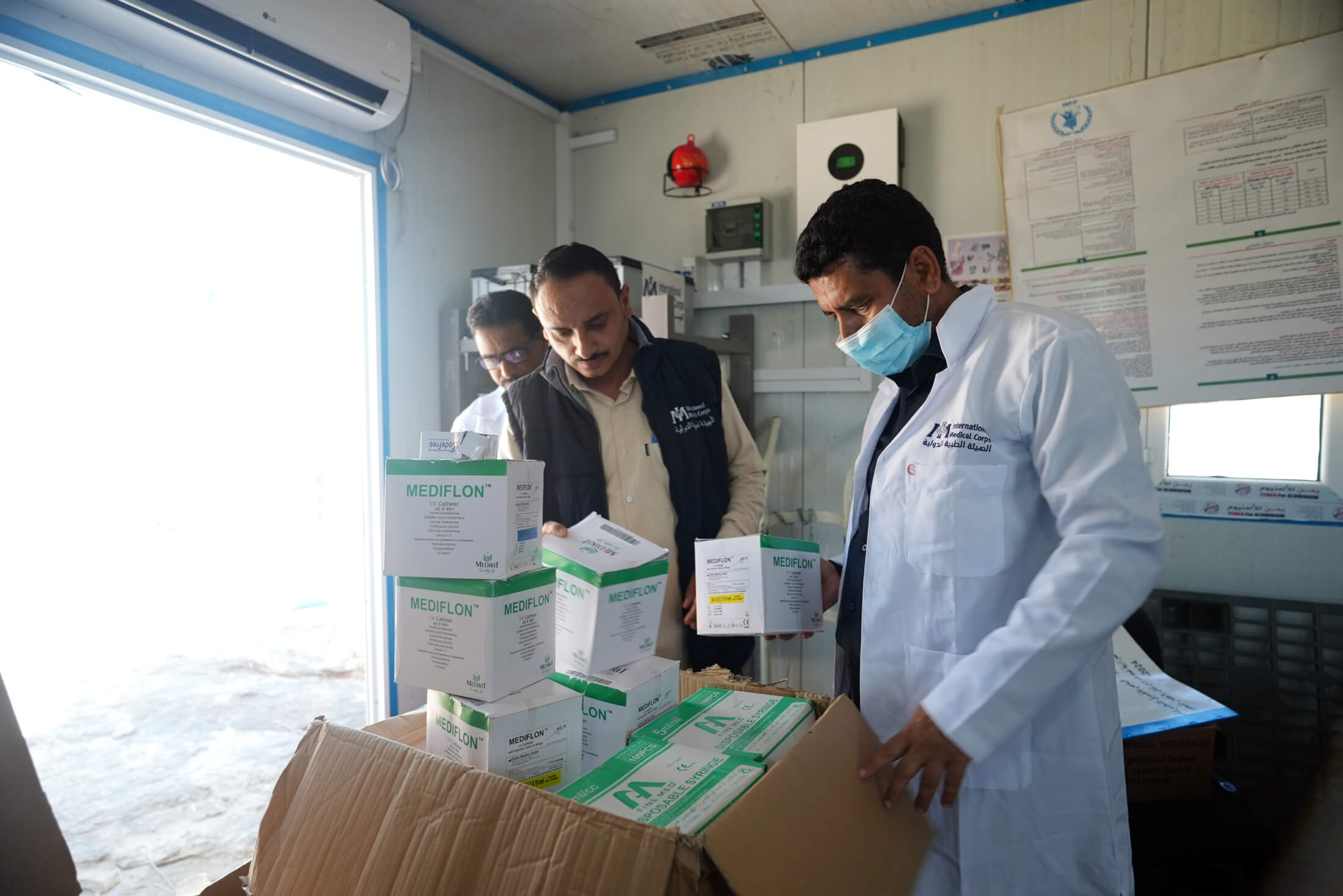 YEM_DSC04996 Staff members unpack supplies as they arrive to Al Hakal Health Center.