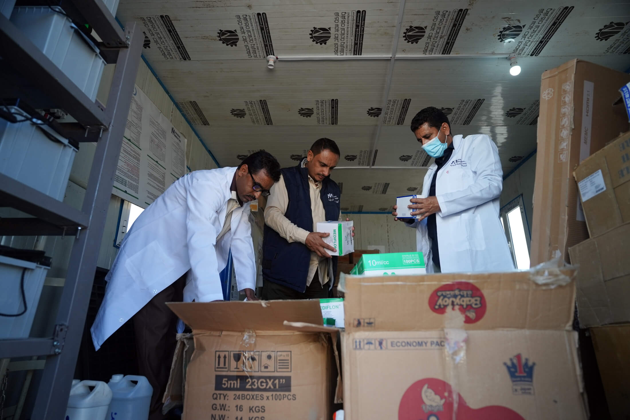 YEM_DSC05018 Staff members unpack supplies as they arrive to Al Hakal Health Center.