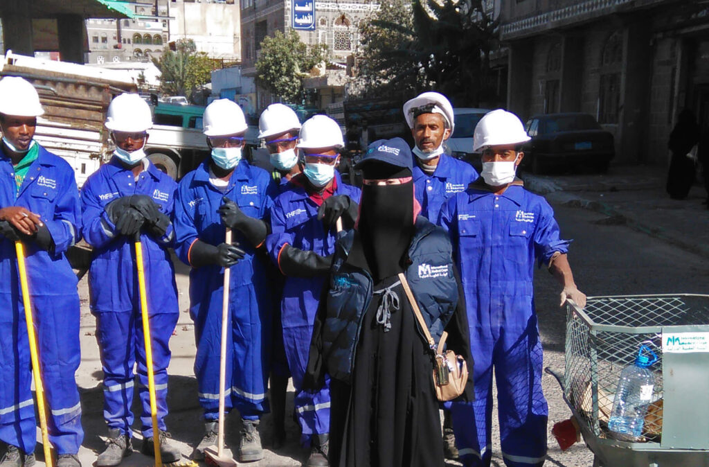 Rezk Allah with the community road cleanup crew responsible for removing trash from main streets in a suburb of Ibb