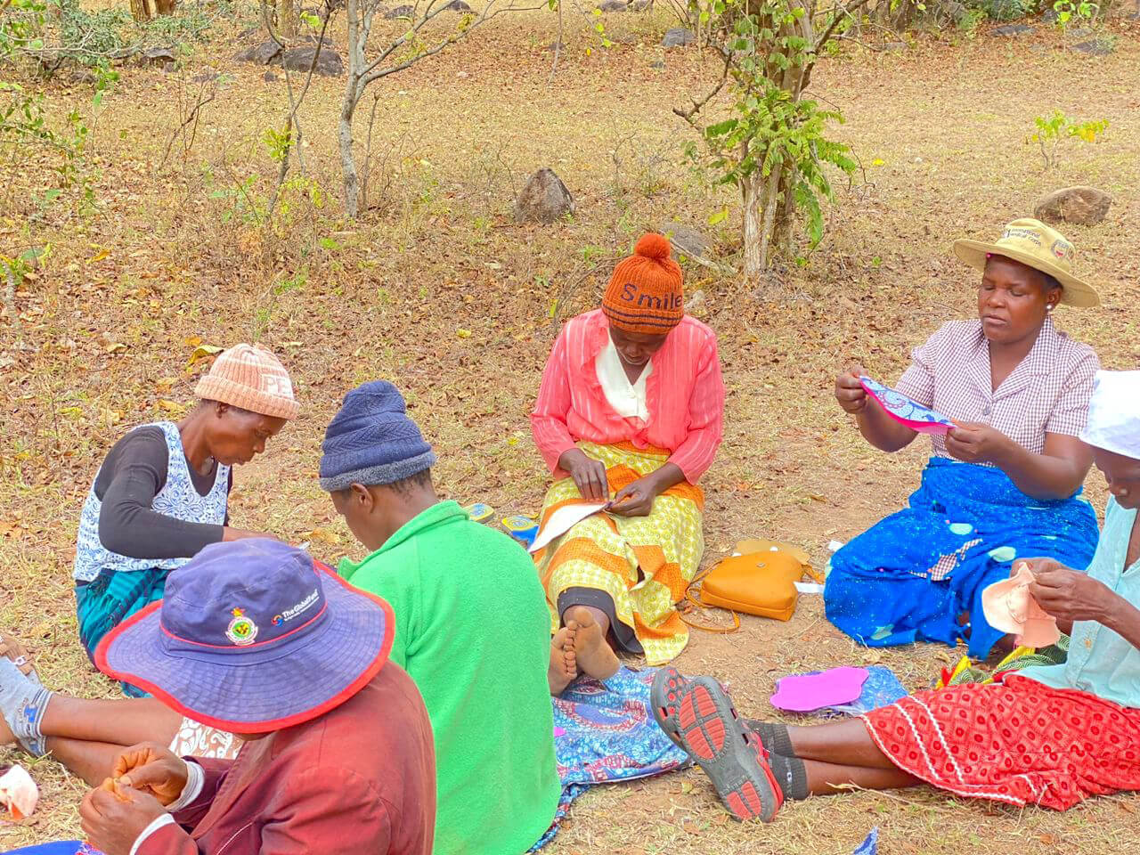 ZIM_CHC-members-sewing-pads_ed Community health workers sew reusable sanitary pads.